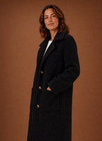 Side view of the Women's long teddy coat highlighting the longline fit and full-length sleeve