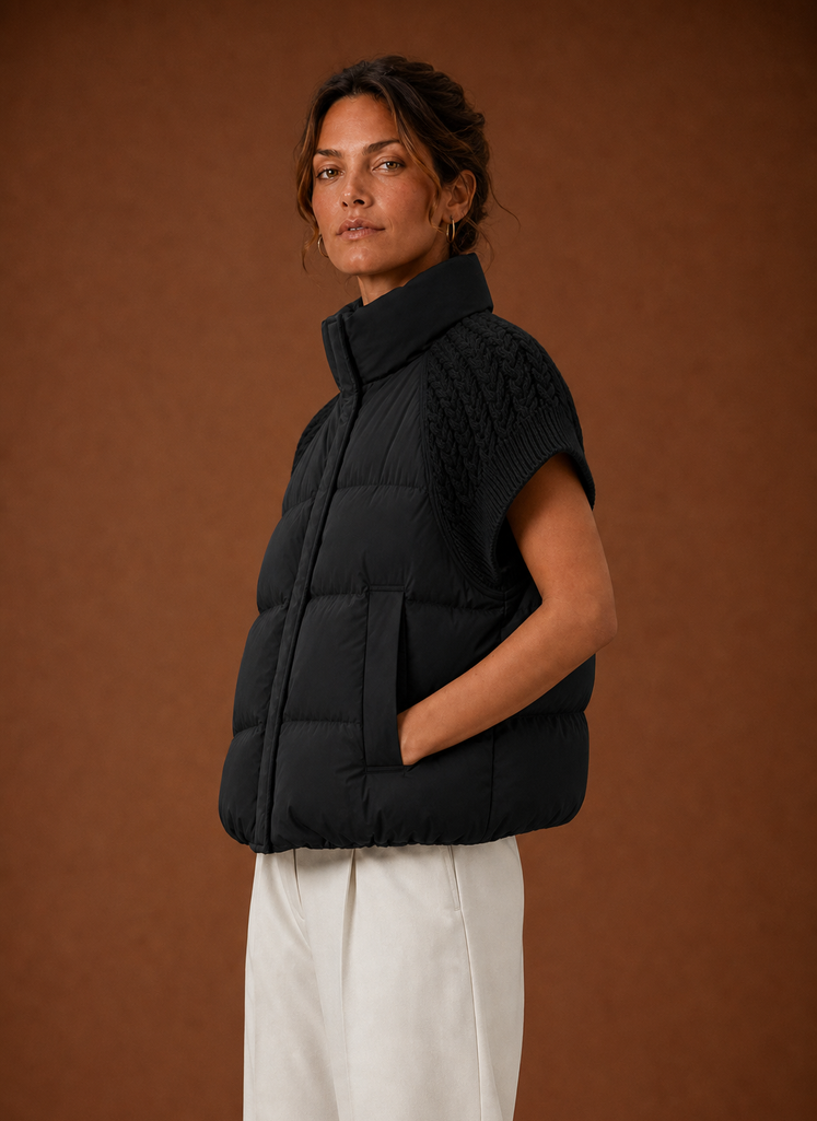 Side view of women's knit-shoulder puffer vest showing sleeveless profile