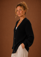 Side view of women's V-neck knit cardigan showing sleeve drape and silhouette