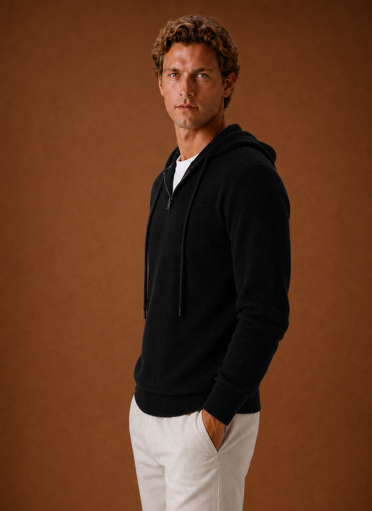 Side profile of the men's hooded half-zip knit sweater highlighting sleeve shape and silhouette