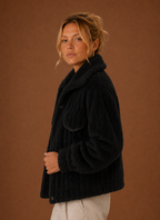 Side profile of the oversized teddy jacket showing relaxed silhouette and sleeve shape