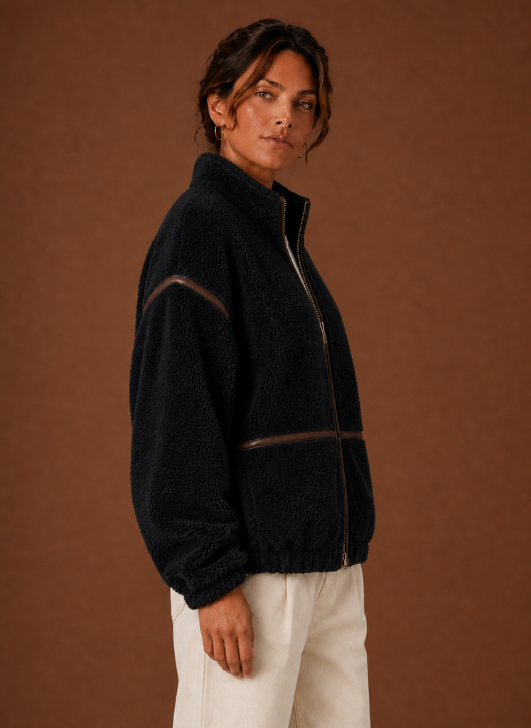 Side view of women's sherpa jacket highlighting collar and relaxed fit