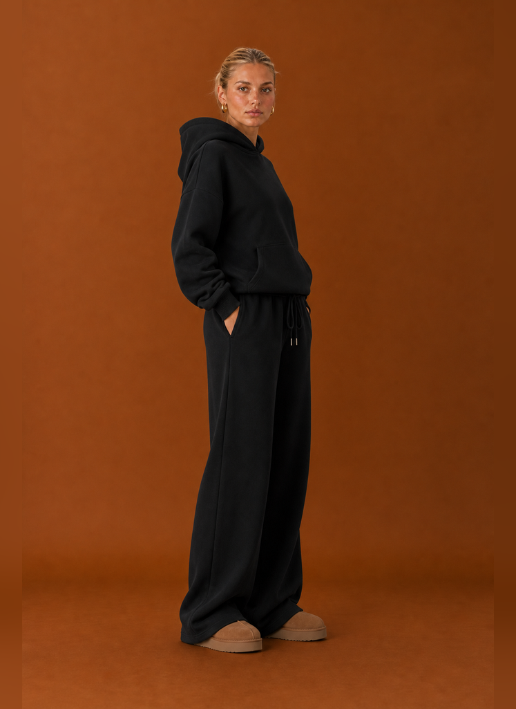 Side profile of the sweatsuit highlighting the fit of the top and pants