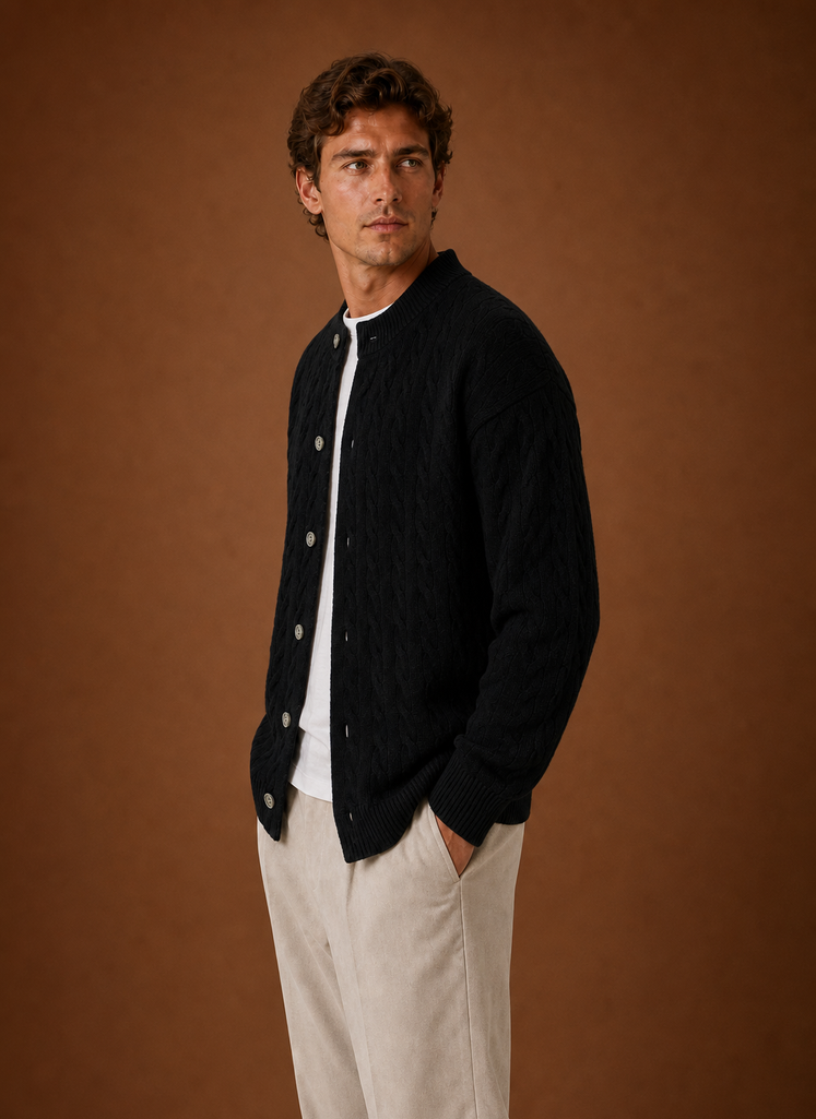 Side profile of men's cable knit cardigan showing long sleeve silhouette