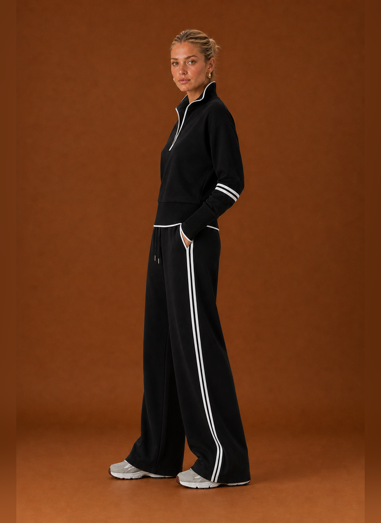 Side profile of the tracksuit set highlighting the sweatshirt and jogger silhouette