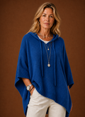 Front view of oversized hooded pullover on mannequin showing hood and relaxed fit