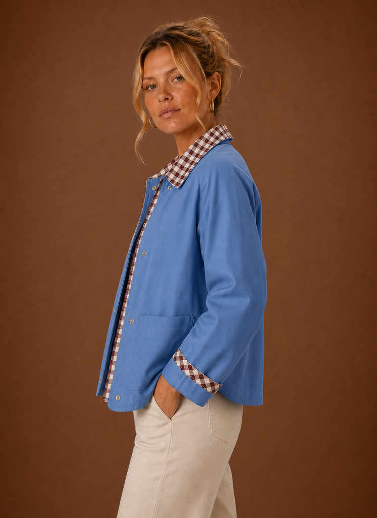 Side view of the barn jacket highlighting the relaxed fit and cropped silhouette