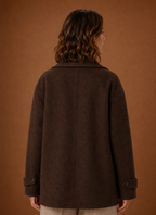 Back view showing relaxed fit and straight back of the women's long coat