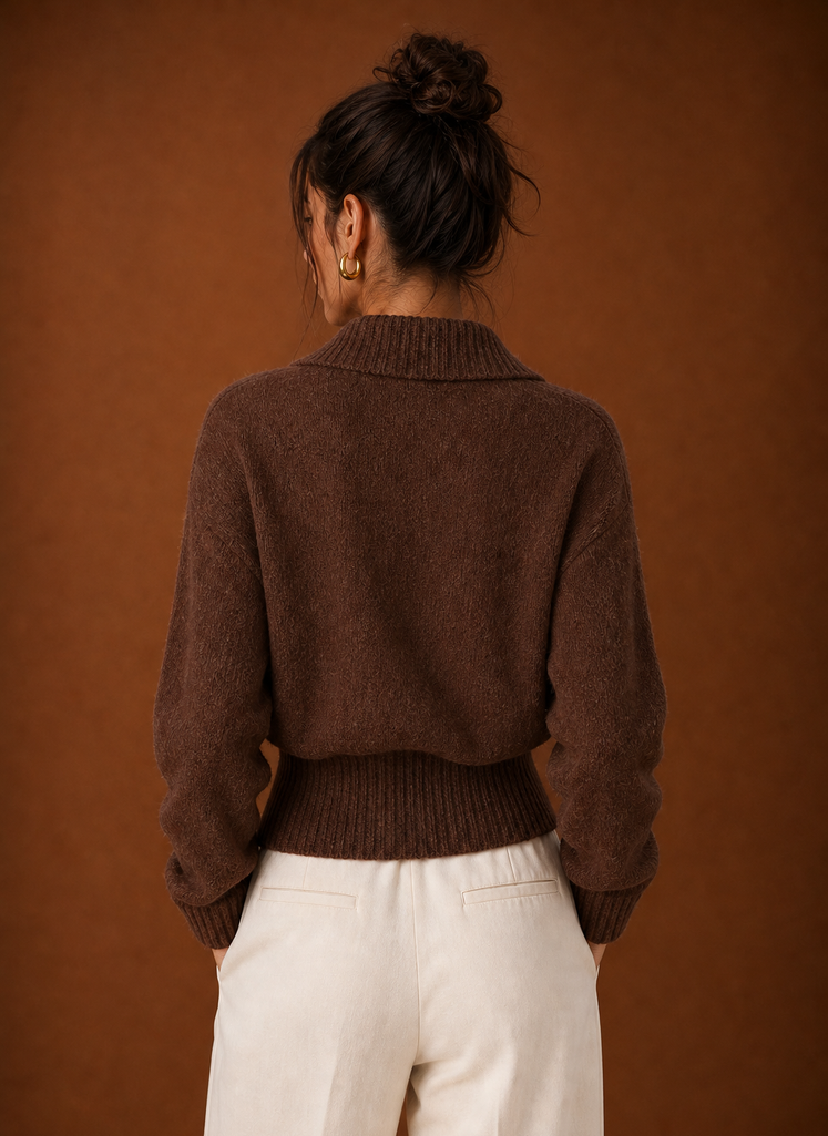 Back view of ribbed knit sweater showing clean hemline and smooth back panel