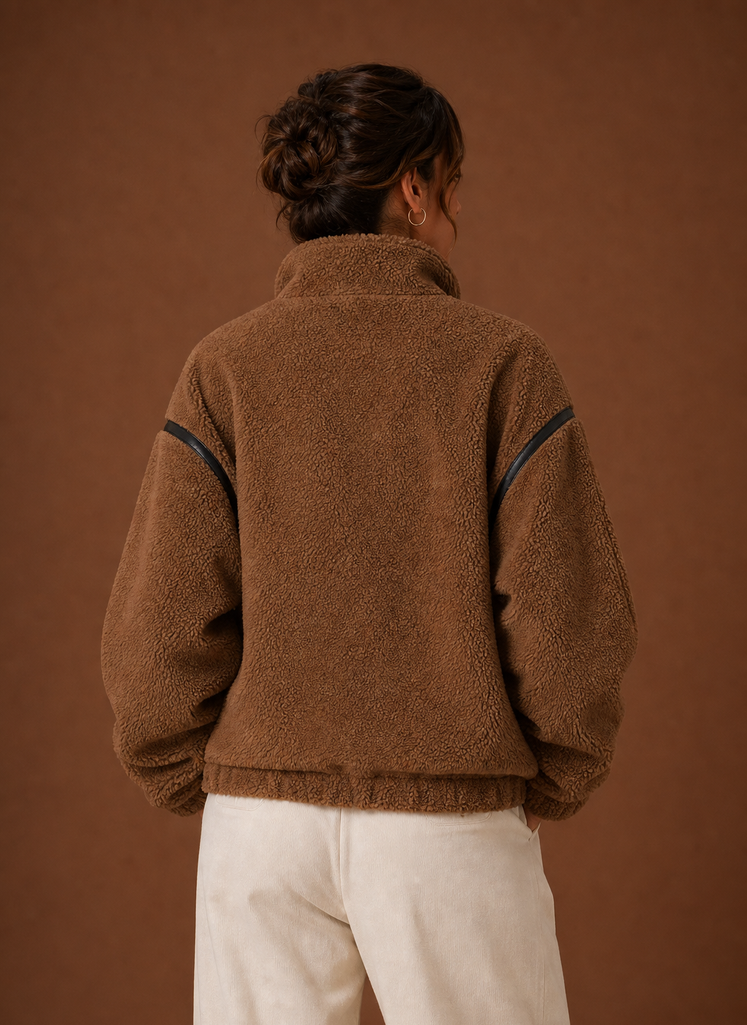Back view of women's sherpa jacket showing hip-length silhouette