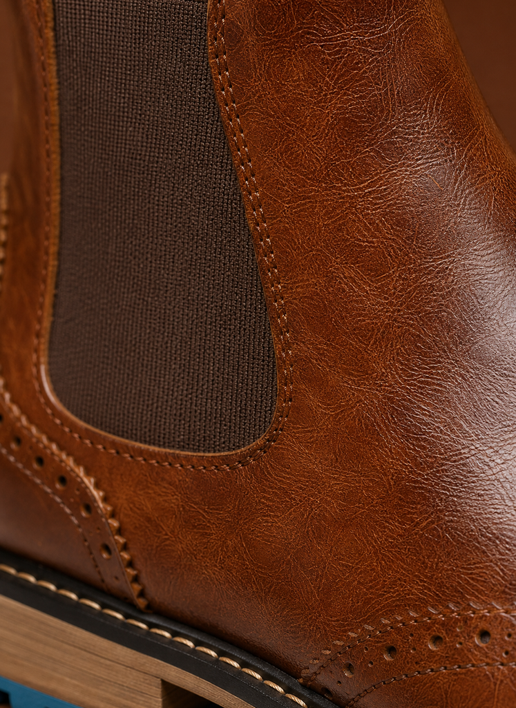 Close-up of brogue wingtip perforation and stitching on the Chelsea boot