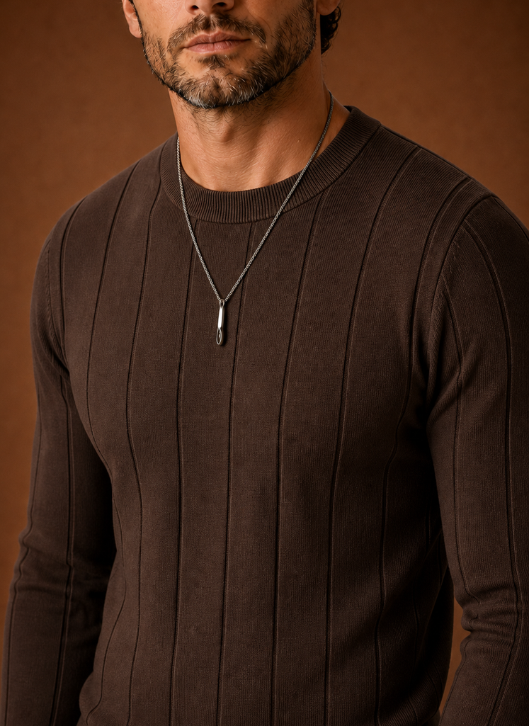 Close-up of ribbed collar and cuff details on the crew neck sweater