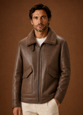 Front view of men's winter coat on mannequin showing tailored overcoat silhouette