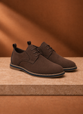 Front view of a black men's derby dress shoe showing the toe and lacing on a neutral background
