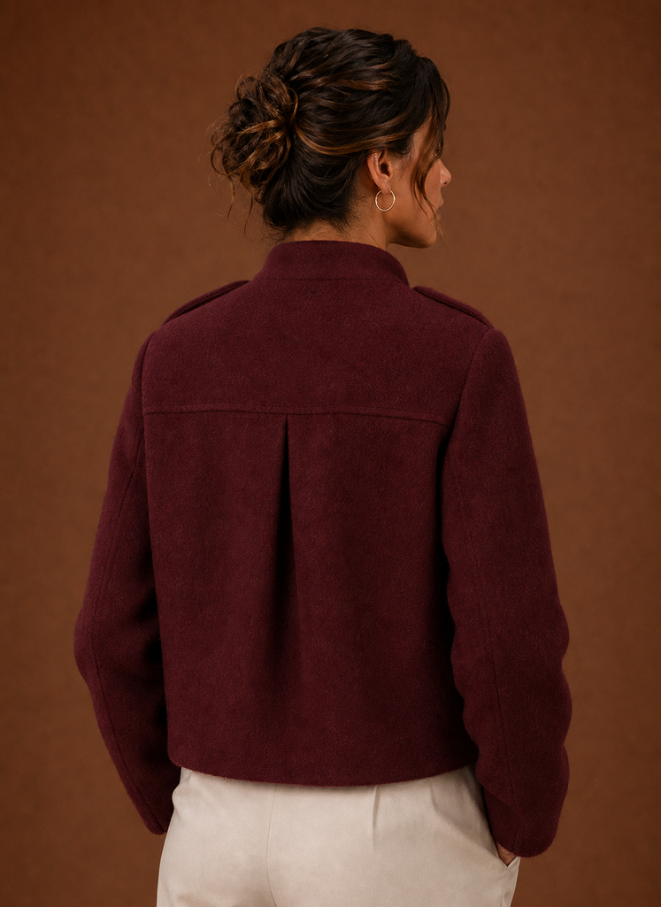 Back view of the cropped button-front coat highlighting the hemline