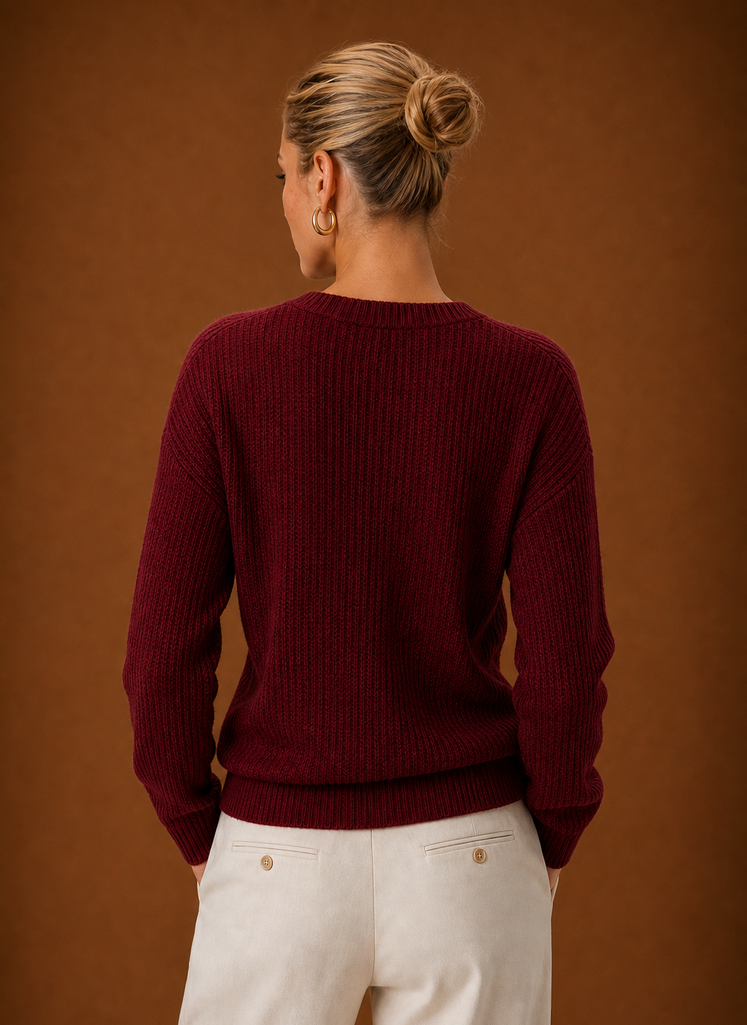 Back view showing ribbed knit back and clean hem of the wrap sweater