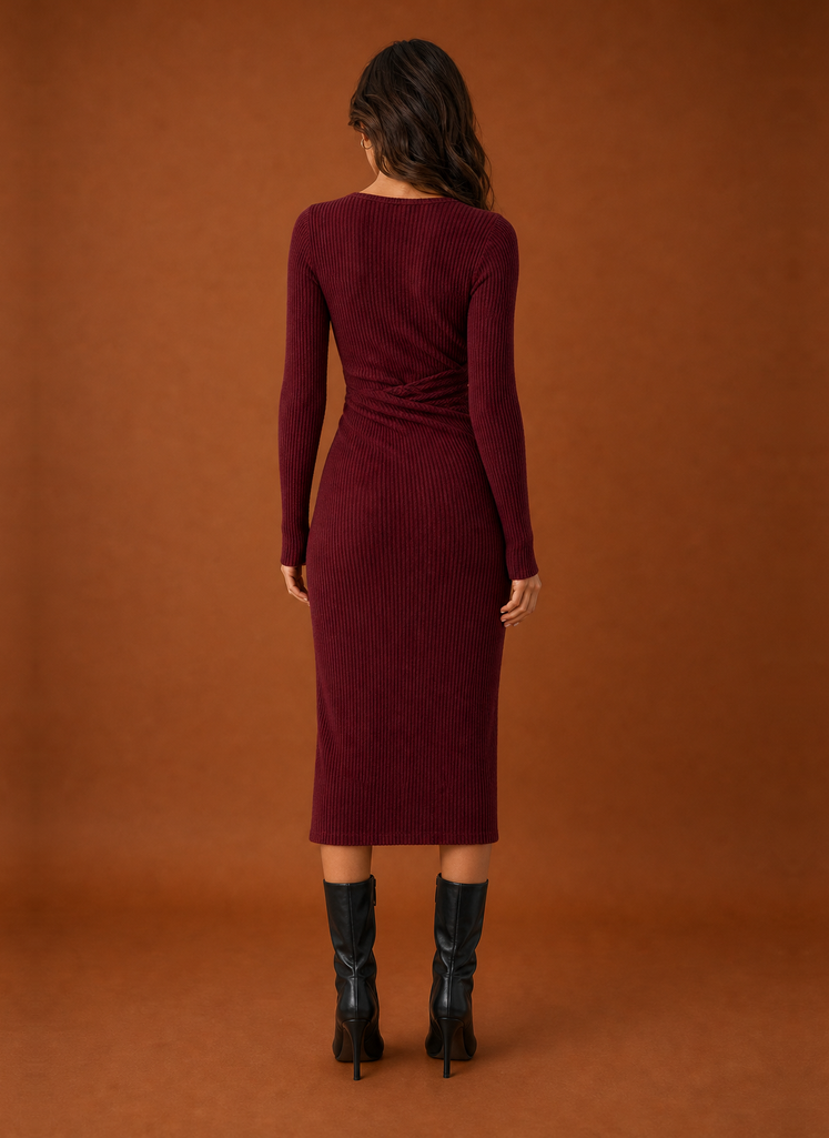 Back view of women's sweater dress with straight hemline
