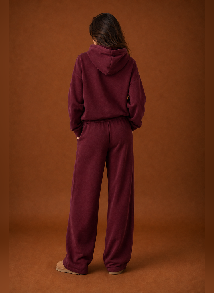 Back view of the two-piece women's sweatsuit showing sweatshirt and matching pant details