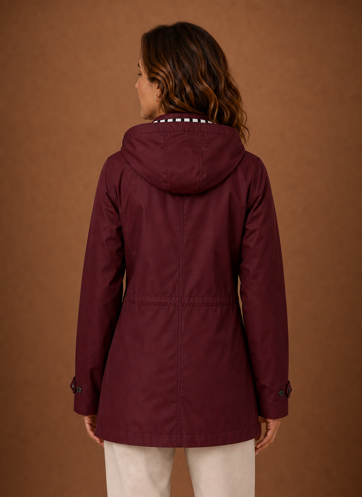 Back view of women's hooded trench coat showing hood and clean back seam