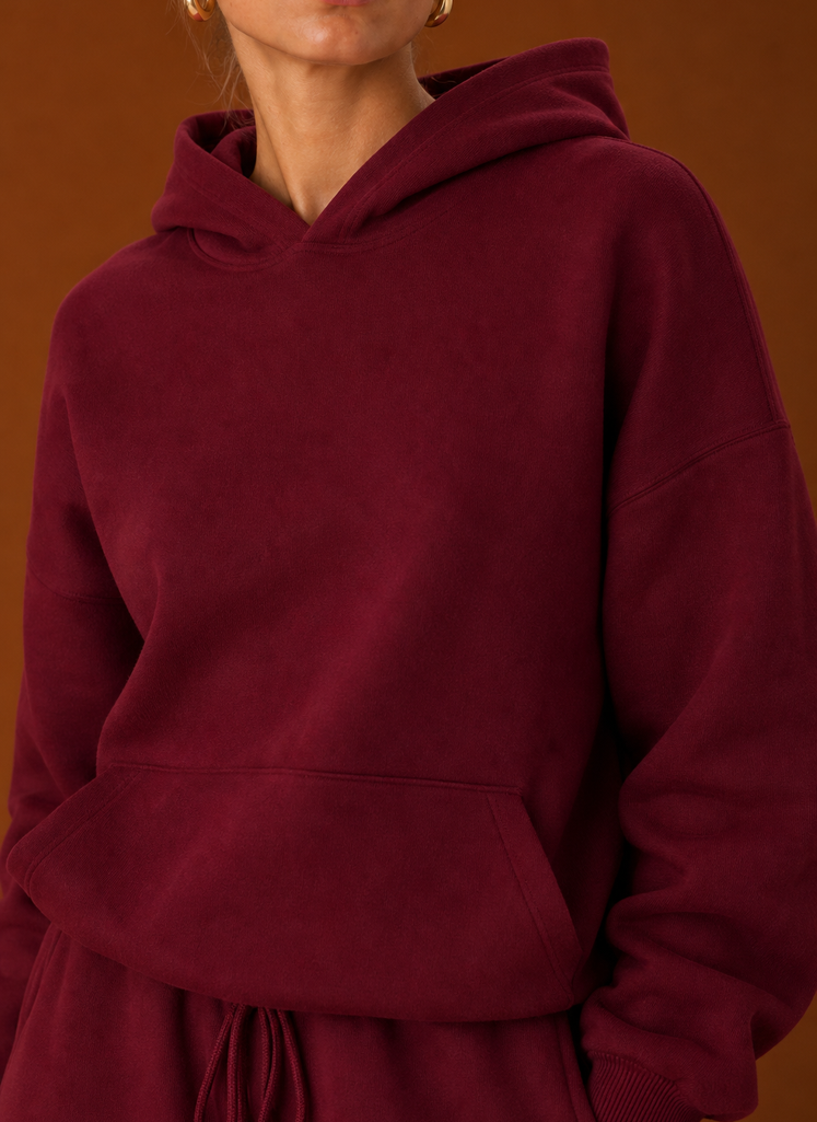 Close-up of the sweater and pants showing fabric texture and seam details