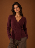 Front view of women's wrap cardigan with tie waist belt on a mannequin