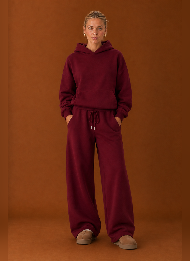 Front view of two-piece sweatsuit set showing sweater and pants on a model