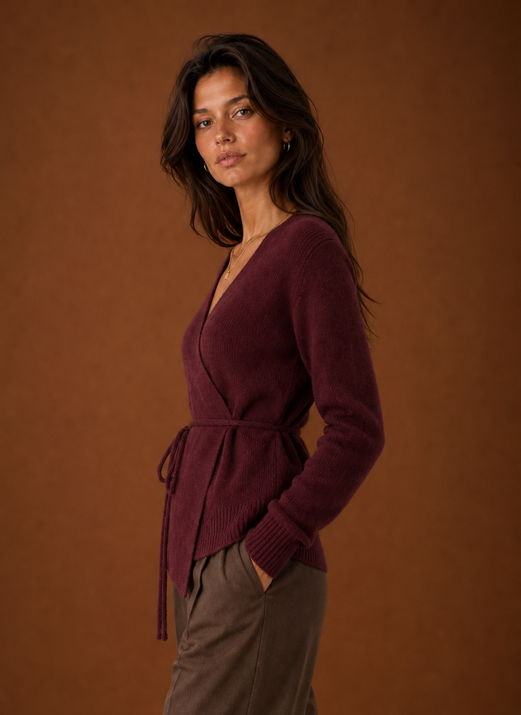 Side view showing the wrap silhouette and tied waist of the women's cardigan