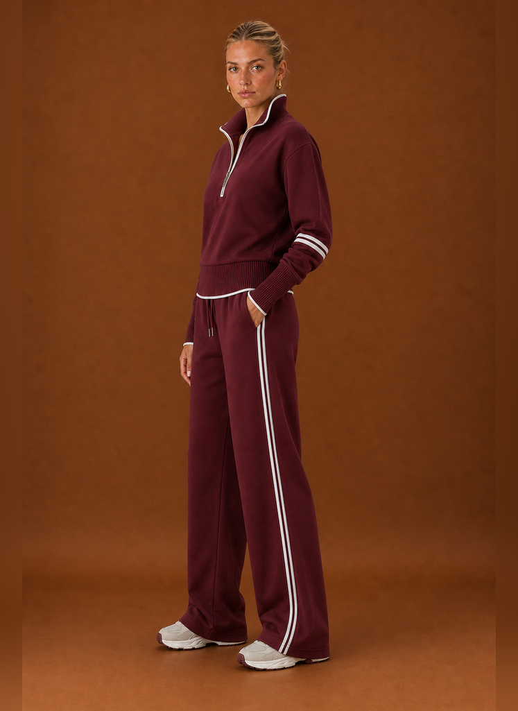 Side profile of the tracksuit set highlighting the sweatshirt and jogger silhouette