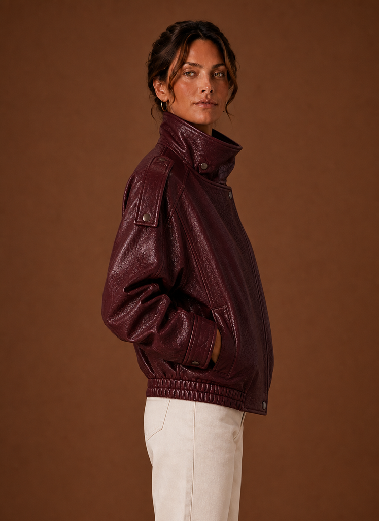 Side profile of the Funnel Neck Jacket highlighting collar height and sleeve length.