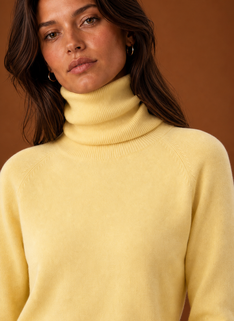 Close-up of the turtleneck collar and knit texture of the sweater