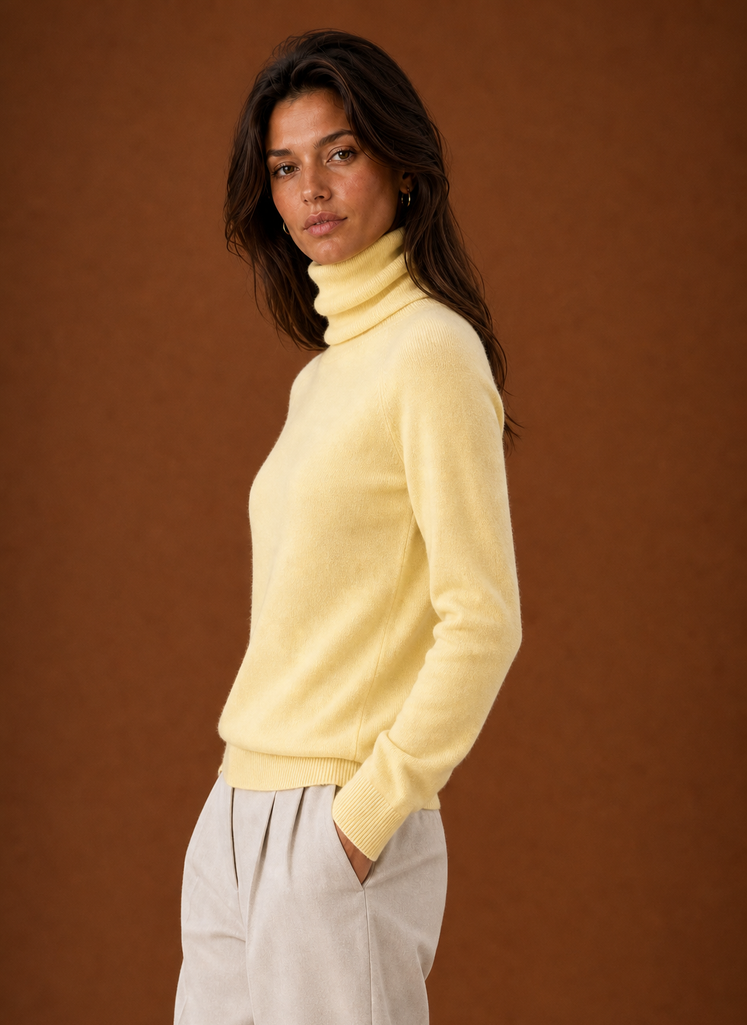 Side view showing the turtleneck and sleeve profile of the sweater