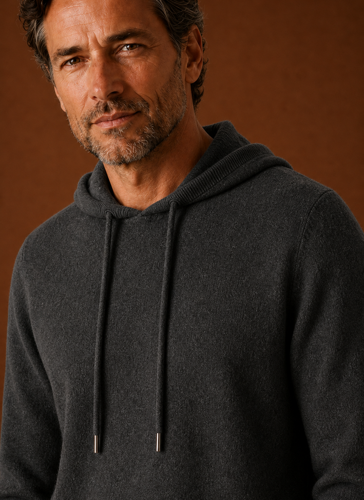 Close-up detail of the knitted texture and hood seam on the Areleon sweater