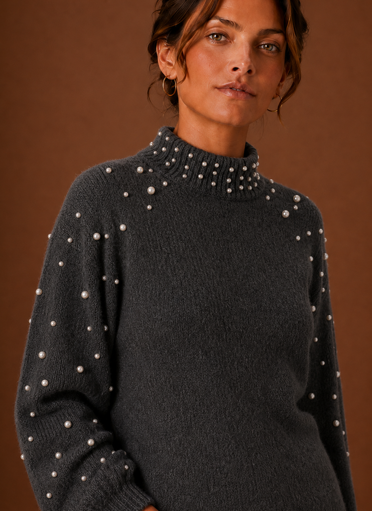 Close-up of pearl embellishment detailing on the knit pullover
