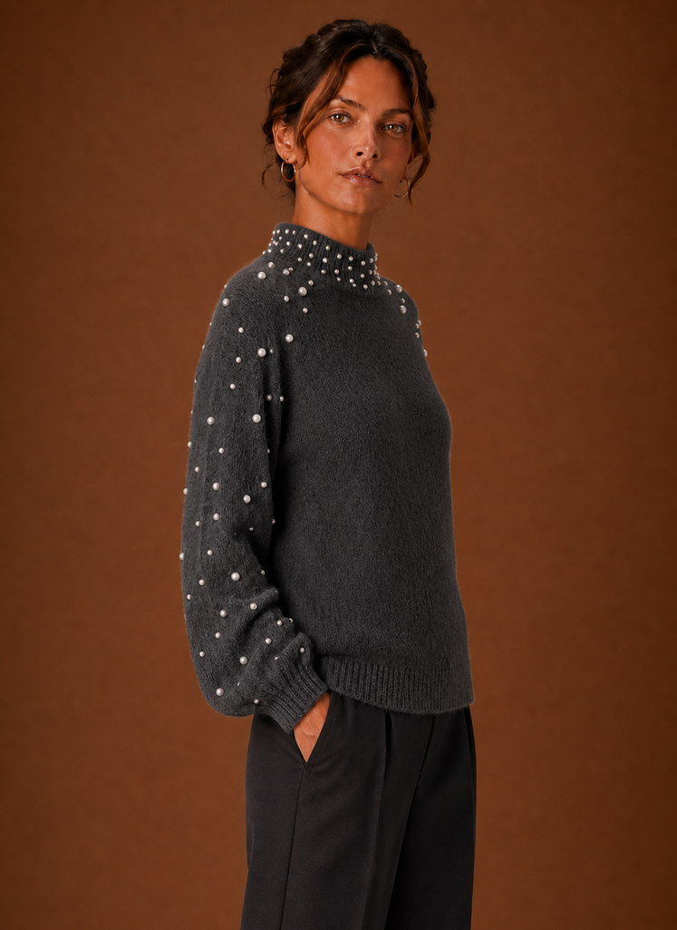 Side view of women's pearl embellished knit pullover showing silhouette