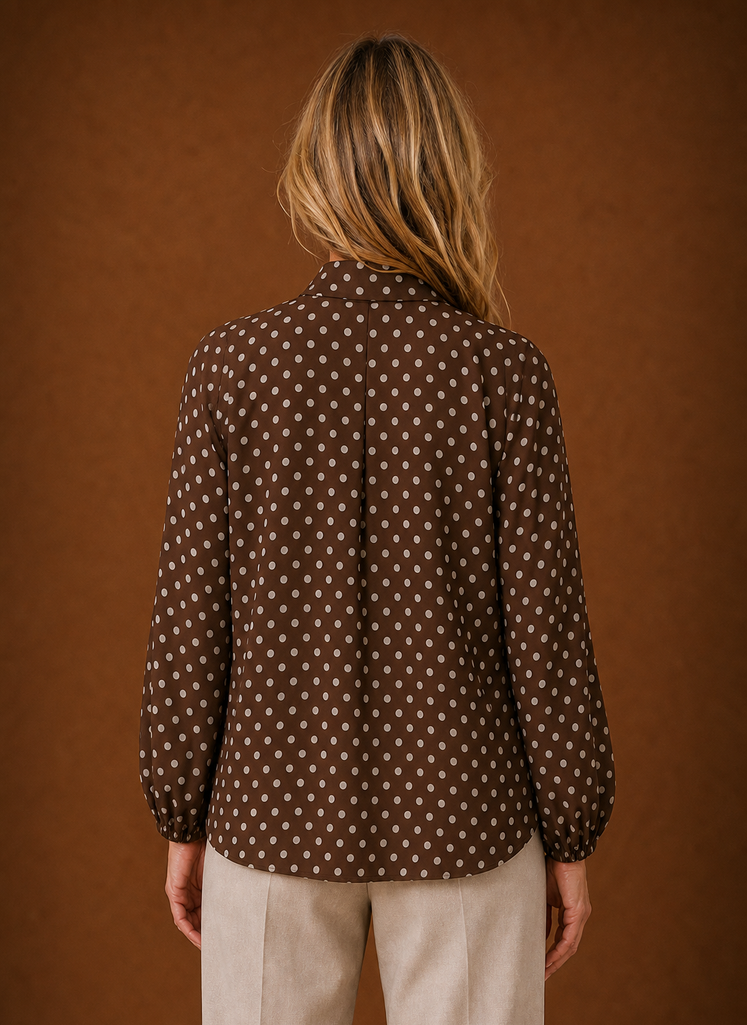 Back view of the blouse showing the high neckline and rear fit