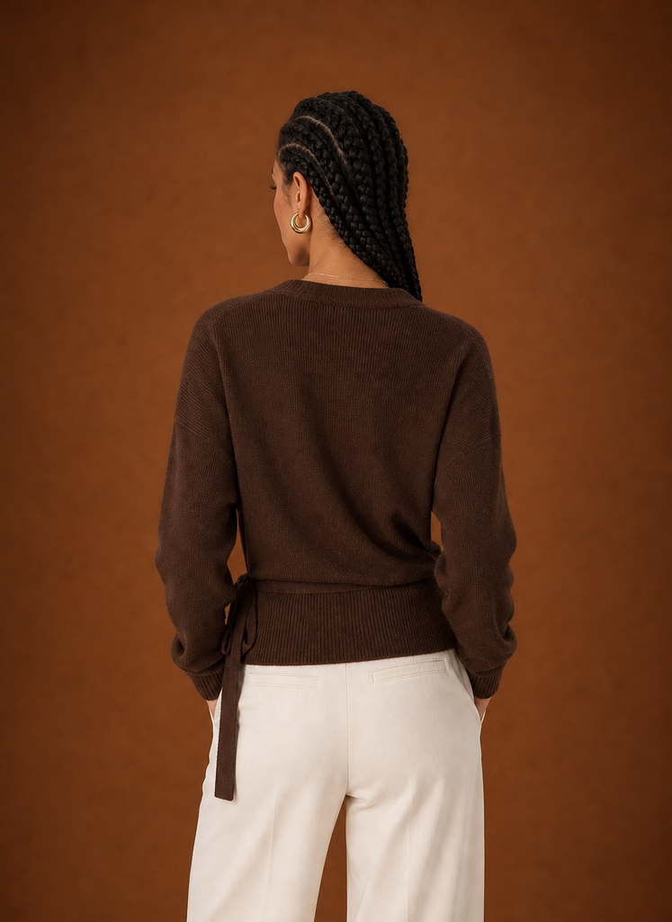 Back view of the sweater showing smooth knit finish and cropped hem