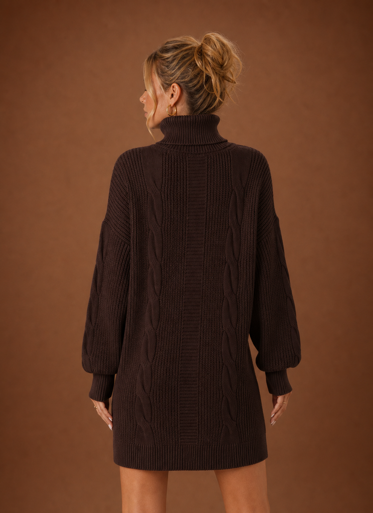 Back view of women's turtleneck sweater dress showing the rear silhouette and neckline