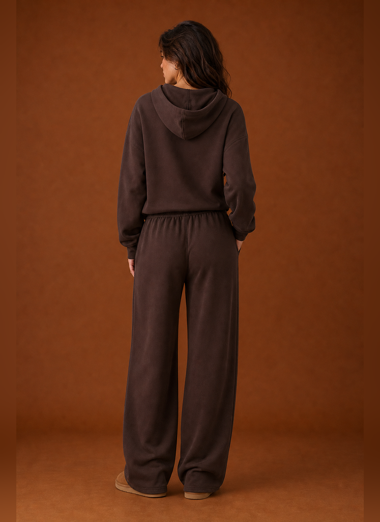 Back view of the two-piece women's sweatsuit showing sweatshirt and matching pant details