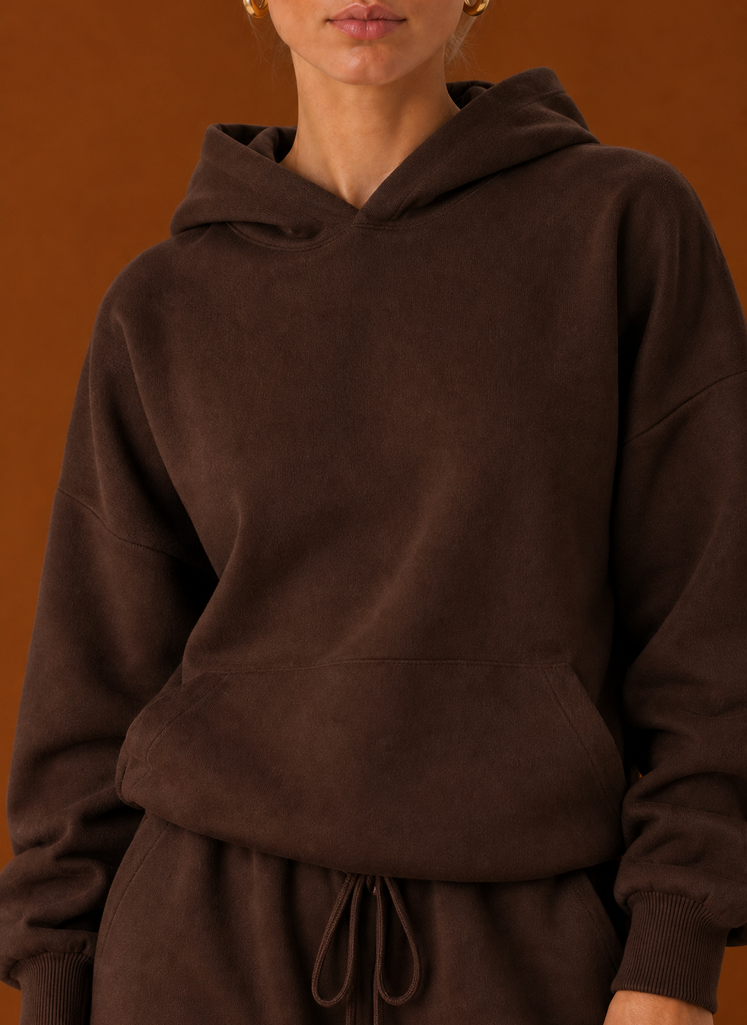 Close-up of the sweater and pants showing fabric texture and seam details