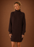 Front view of women's turtleneck sweater dress showing the turtleneck neckline and overall knit silhouette