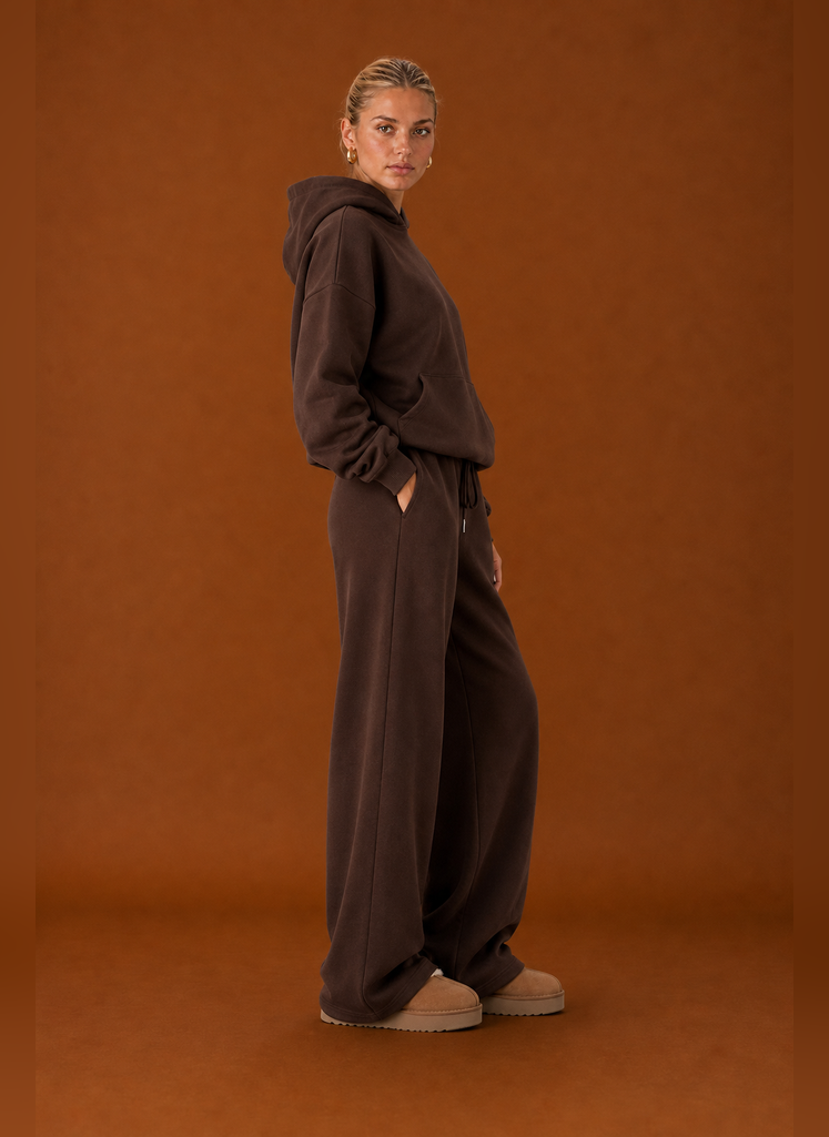 Side profile of the sweatsuit highlighting the fit of the top and pants