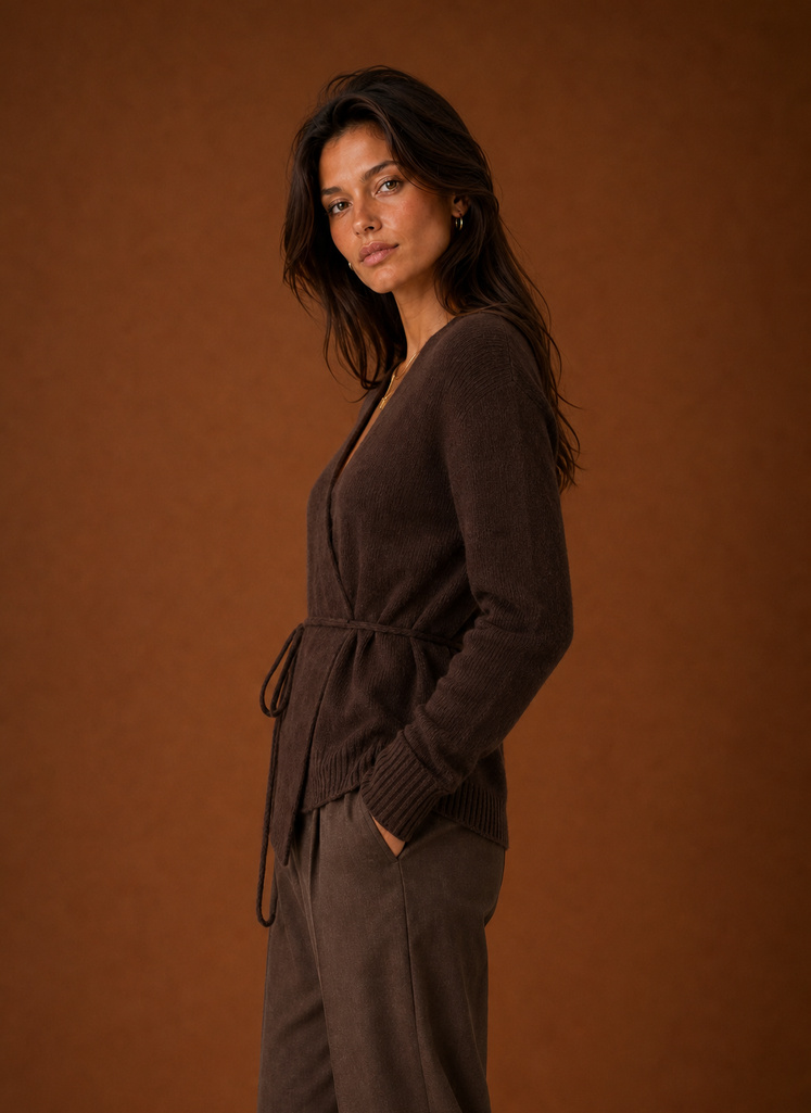 Side view showing the wrap silhouette and tied waist of the women's cardigan