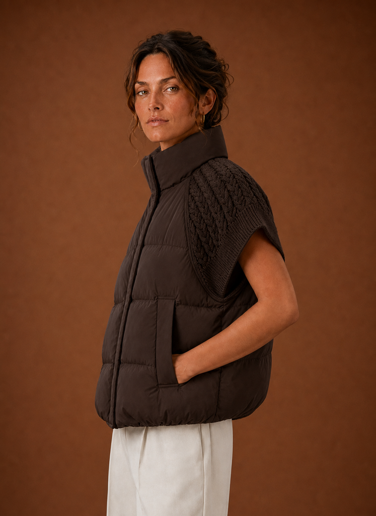 Side view of women's knit-shoulder puffer vest showing sleeveless profile
