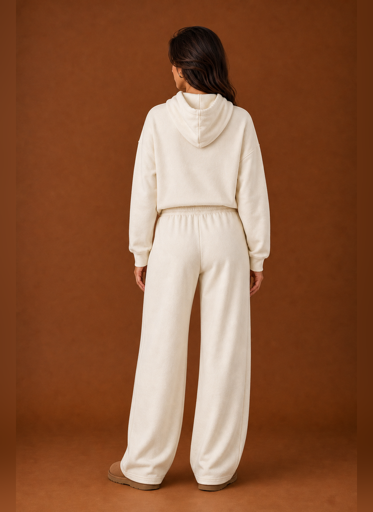 Back view of the two-piece women's sweatsuit showing sweatshirt and matching pant details