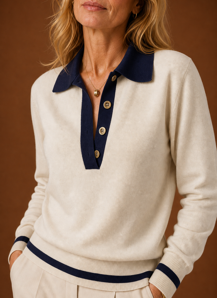 Close-up of the polo collar, button placket, and ribbed trim on the cream sweater