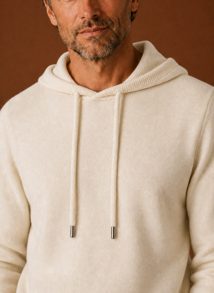 Close-up detail of the knitted texture and hood seam on the Areleon sweater