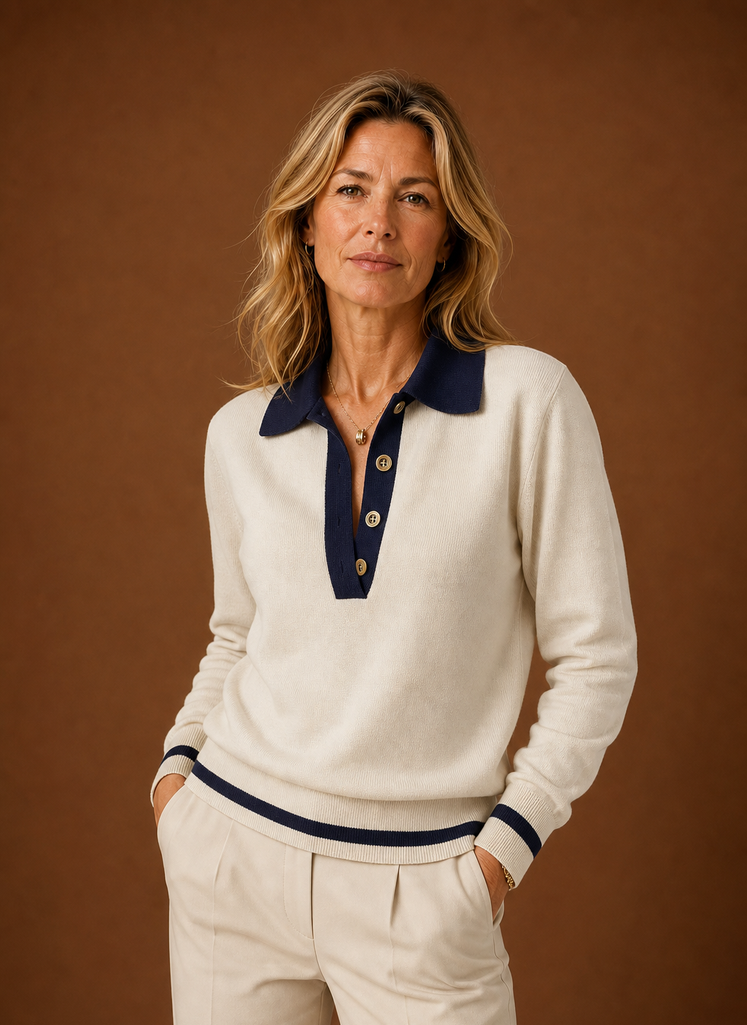 Front view of women's cream polo sweater on a mannequin showing polo collar and button placket