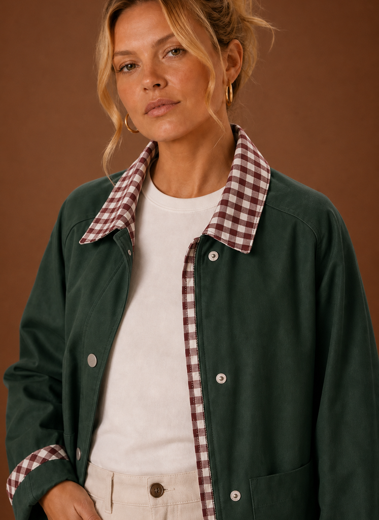 Close-up of the contrast check collar, cuff detailing, and stitching
