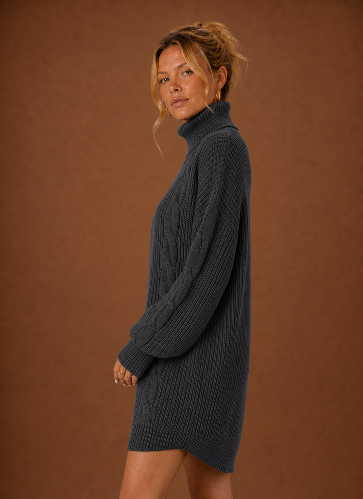 Side view of women's turtleneck sweater dress highlighting the profile and drape