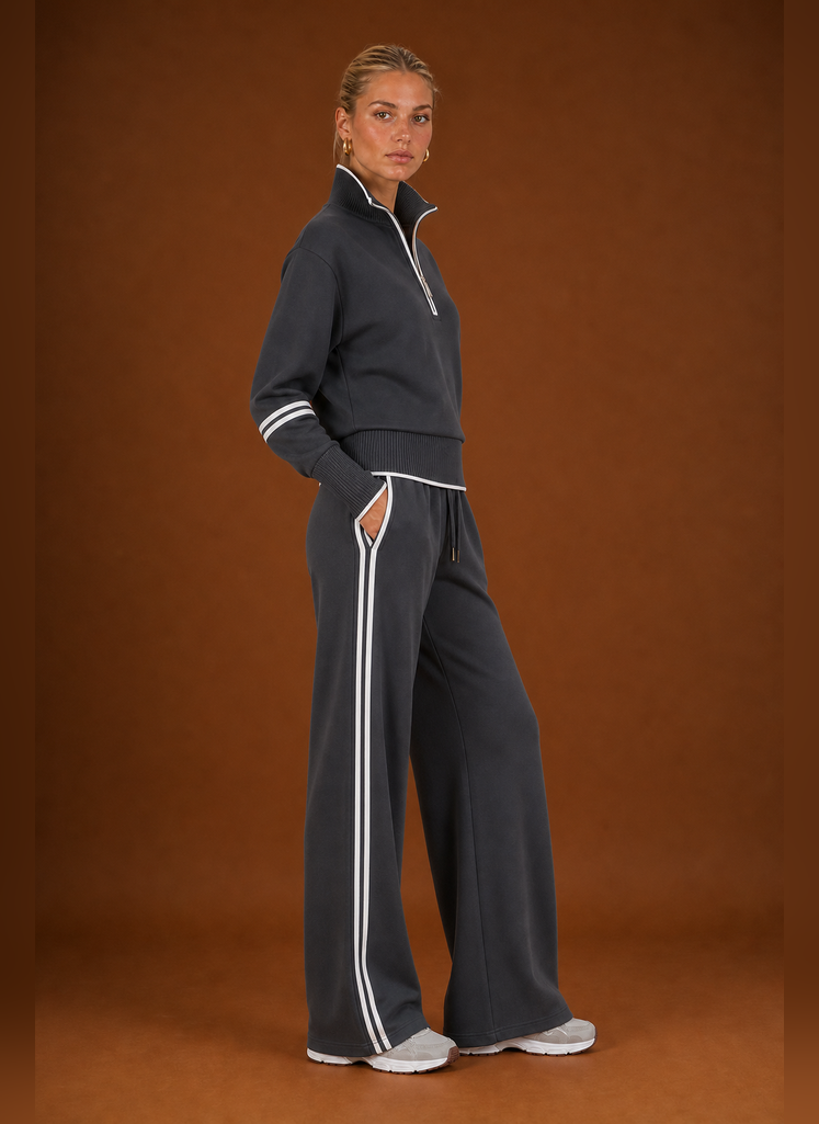Side profile of the tracksuit set highlighting the sweatshirt and jogger silhouette